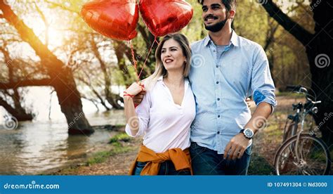 Picture Of Romantic Couple Standing Outside With Baloons Stock Photo Image Of Female Baloons