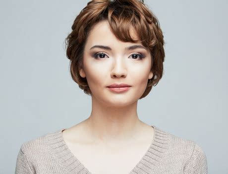 Fabulous silver blonde pixie bob women who have always wanted to make the big pixie chop but felt insecure about their round face shape should consider a pixie with a deep side part and long bangs. Feminine pixie cuts for round faces