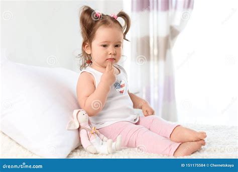 Adorable Little Baby Girl Sitting On Bed Stock Photo Image Of