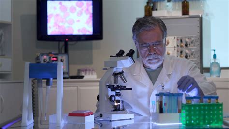 Cancer Scientist Looking At Blood Sample Stock Footage Sbv 338535375
