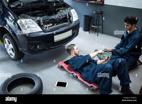 Mechanics Repairing A Car Stock Photo Alamy