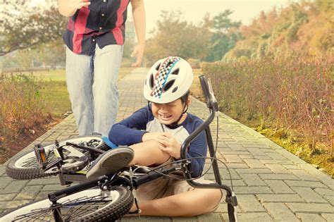 Child Crying After Falling From Bicycle Stock Photo Download Image
