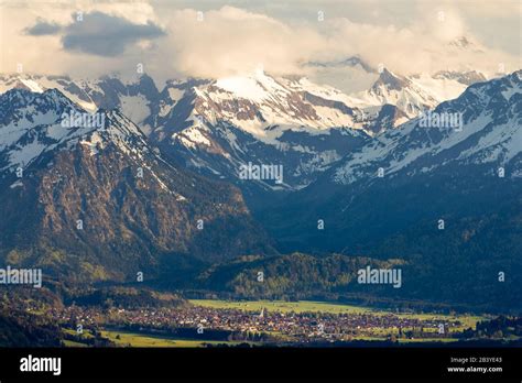 Amazing View Snow Covered Mountains With Village In Valley Sunset Or