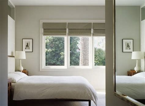 They can be used as room darkening shades, or they can be left open for more natural light with the added benefit of reducing the glare during daylight hours bedroom with roman blinds - Decoist