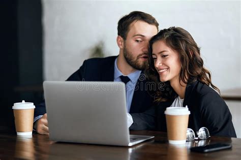 Young Couple Whispering At Work Stock Image Image Of