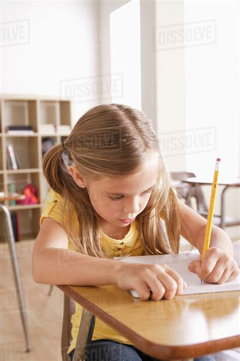 Schoolgirl Writing In Notebook Stock Photo Dissolve