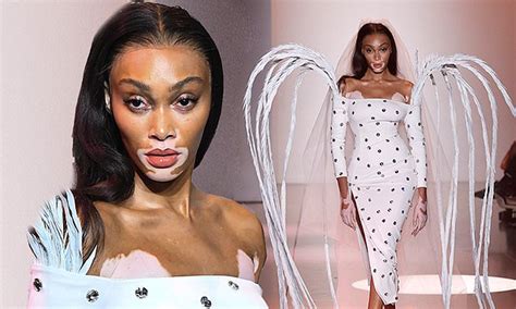 Winnie Harlow Rocks A White Midi Dress With A Flowing Veil And Wings At
