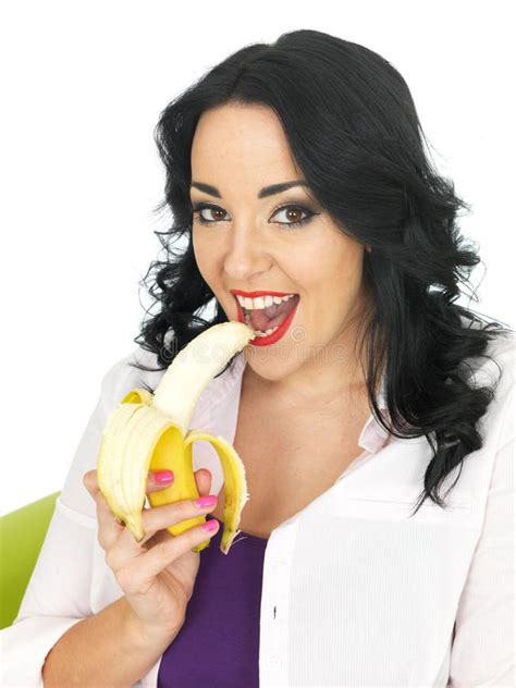 Healthy Attractive Young Woman Eating A Ripe Banana Stock Photo Image