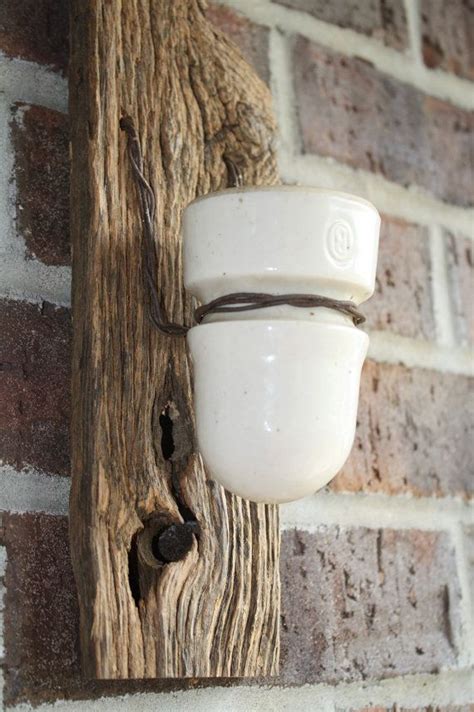 Barn Wood Recycled Candle Sconces With A Small White Vintage Insulator
