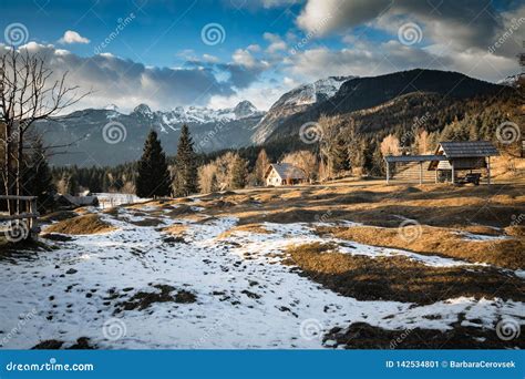 Scenic View In Alpine Forest Mountains With Isolated Wooden Chalet