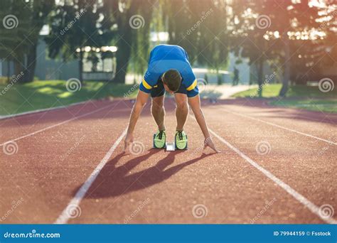 Track Runner In Starting Position On Sunny Morning Stock Image Image