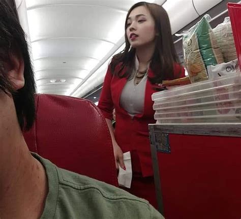 亚航华裔空姐遭乘客偷拍 美照走红网络引众议 海鸟网