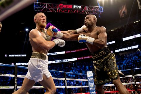 Floyd mayweather defeats an exhausted conor mcgregor in the 10th roundanthony j. Mayweather Vs. McGregor In Pictures 25 Pics Of UFC / WBC ...