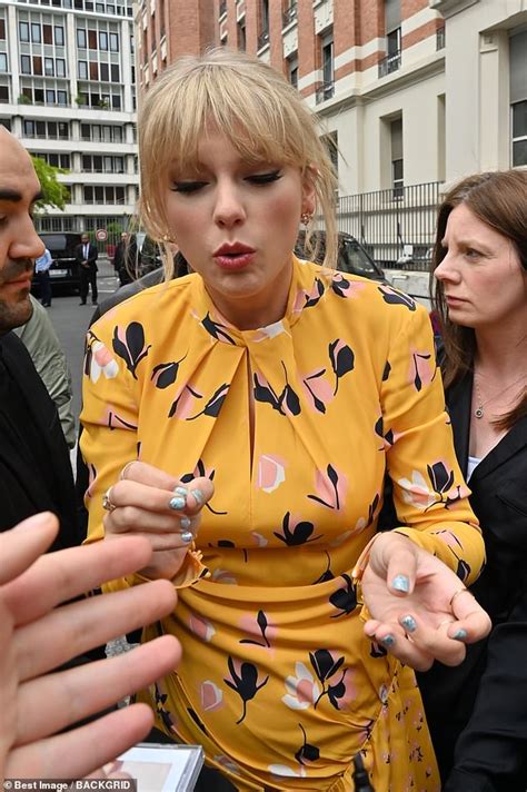 Taylor Swift Flaunts Her Long Legs In A Yellow Floral Dress Daily