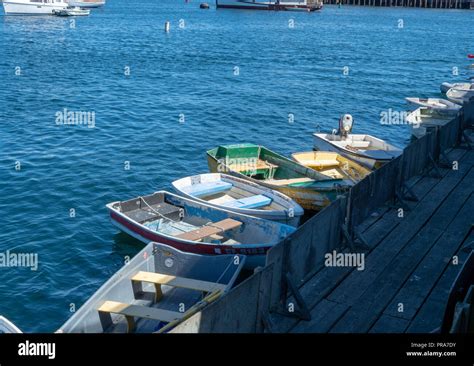 Small Rowing Boats Tied To A Dock Area Stock Photo Alamy