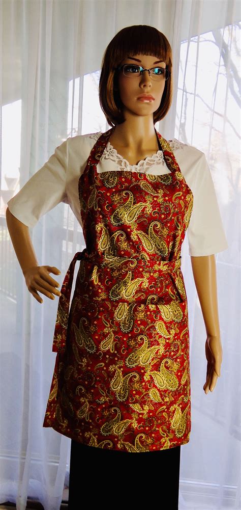 A Mannequin Wearing An Apron And Glasses