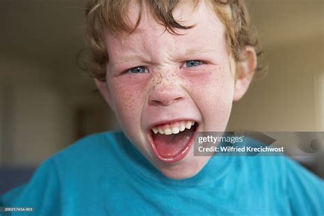 Boy Pulling Face Portrait Closeup High Res Stock Photo Getty Images