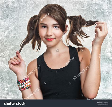 A Beautiful Teen Girl In Black Top Holding Her Pigtails Hot Sex Picture