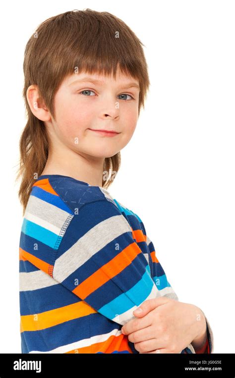 Close Up Portrait Of Schoolboy Standing Confidently With His Arms