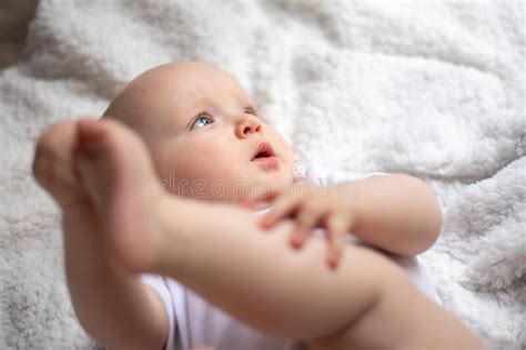 Cute Little Baby Lies On A White Blanket Stock Photo Image Of Bedding