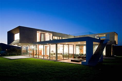 U Shaped House With Glass Lower Floor And Concrete Upper