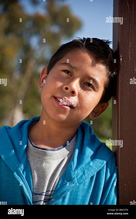 10 12 Year Old Hispanic American Boy Outside Thoughtful Dreaming