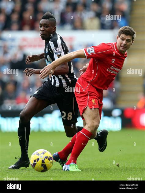 newcastle united s sammy ameobi left vies for the ball with liverpool