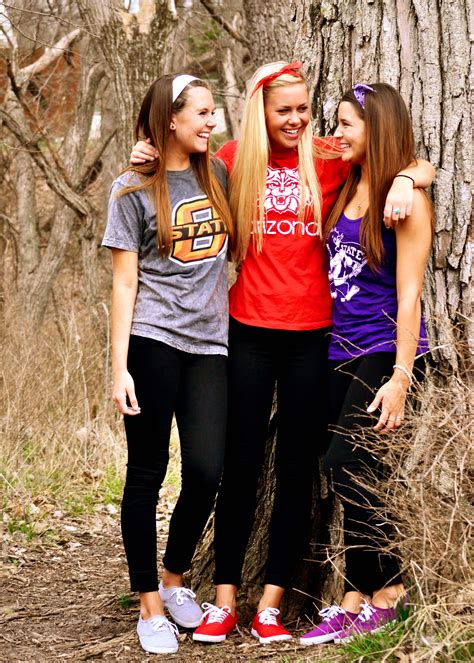 friend senior pictures with each wearing the shirt of the college they are going to don t