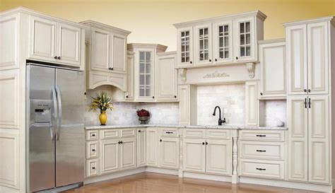 The white paneling ceiling with an exposed beam seems to blend well with the gray cabinets. Beautiful Antique White Kitchen Cabinets | Antique white kitchen, Antique white kitchen cabinets ...