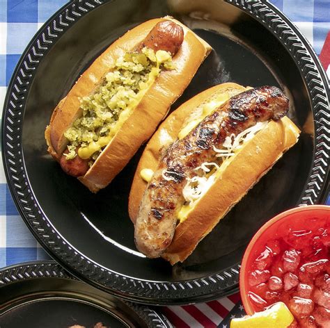 Hot Dogs And Bratwurst With Sauerkraut And Relish Are A Cookout