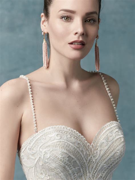 Beautifully detailed with lace and a dazzling swarovski crystal belt, the fitted bodice of this ball gown cascades into a romantic tulle skirt. Pin on Maggie Sottero Alistaire Collection | Wedding Dresses