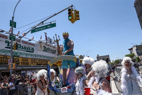 A Man Dressed As Neptune Rides A Float Mermaid Parade Mermaid Coney