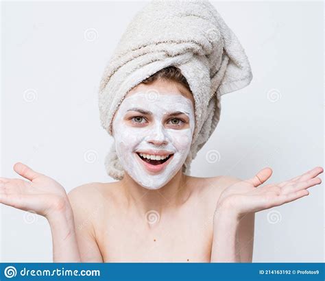 Pretty Woman With Towel On Head Emotions Naked Shoulders And Mask On Face Stock Photo Image Of