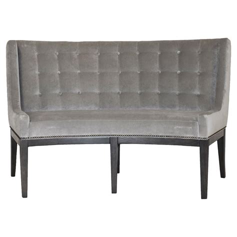 Crafted from sumptuous medium oak, the dining bench brings a warm feel to an interior pairing with a wide variety of modern and classical styled furnishings. Michael Weiss Alton Regency Curved Grey Velvet Dining Bench