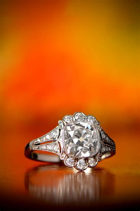A Beautiful Vintage Engagement Ring Featuring A Lively Antique Cushion