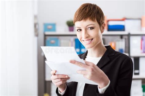 Smiling Businesswoman Holding Paperwork Stock Image Image Of Manager