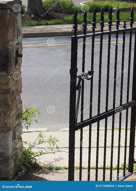 The Black Metal Gate Is Partially Open Stock Photo Image Of Black
