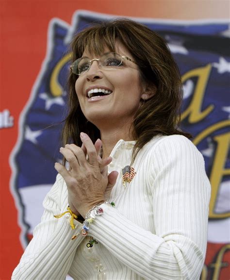 Conservative group backing Sarah Palin buys ad time in Iowa urging her 