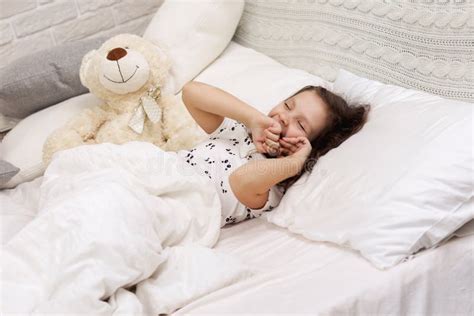 Cute Little Child Girl Wakes Up From Sleep Stock Photo Image Of