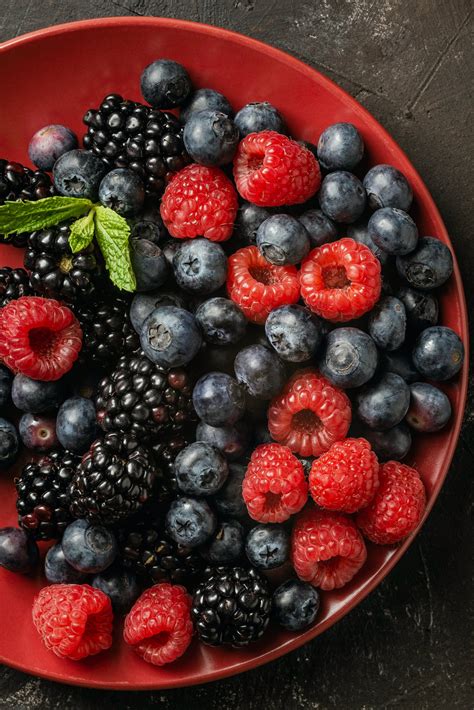 Bowl With Assorted Fresh Berries On Table · Free Stock Photo