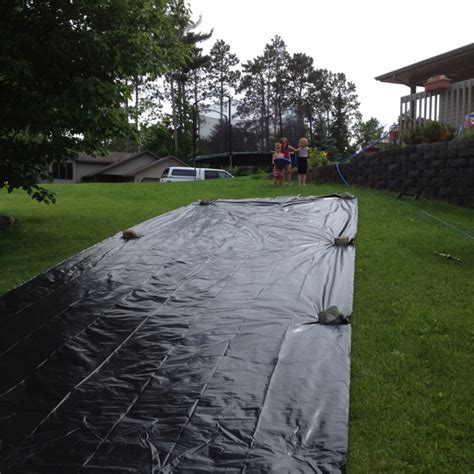 Plan the plastic sheeting roll to have about one foot of extra material on each side of the outside of the noodles. Home made slip and slide. $20 plastic sheeting from Ace ...