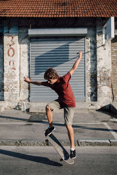 Teenager Jumping With His Skateboard By Boris Jovanovic Jumping Skater