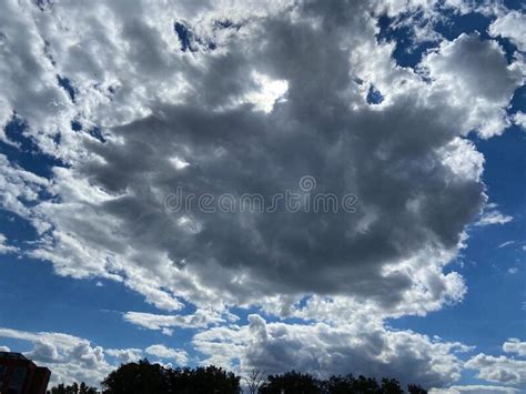 Dramatic Dark Clouds And Blue Sky In September In Fall Stock Photo