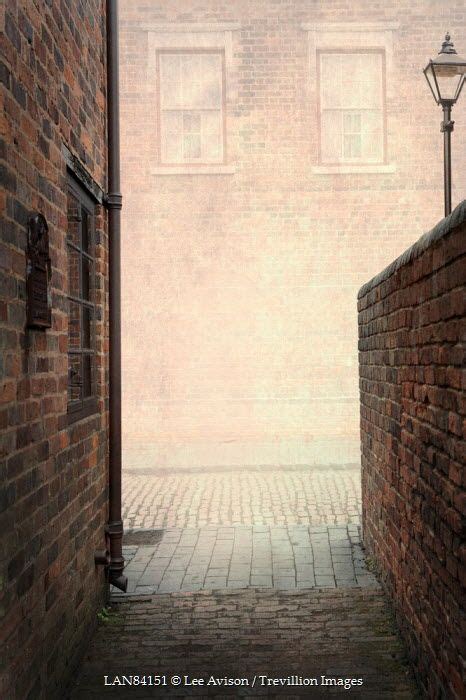 Lee Avison An Alleyway Entering A Red Brick Cobbled Road Streetsalleys