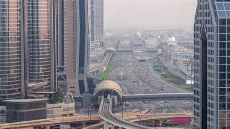 Busy Sheikh Zayed Road Aerial Day To Night Timelapse Metro Railway And