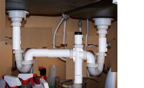 The fix is to either install an air admittance valve (aav) in your kitchen sink drain plumbing or. Install of Vent under two bowl sink