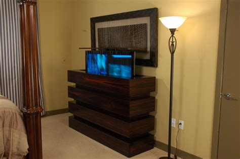 This hand carved tv lift cabinet is made to order and dimensions will be based on your tv size and other technology component needs. Le Bloc TV lift cabinet in bedroom. TV lift cabinets by ...