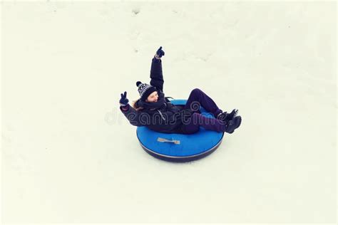 Happy Young Man Sliding Down On Snow Tube Stock Photo Image Of