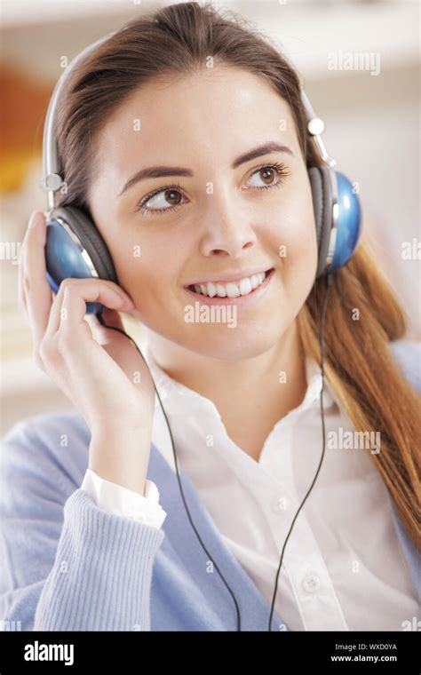 Woman Wearing Headphones Listening To Music Stock Photo Alamy