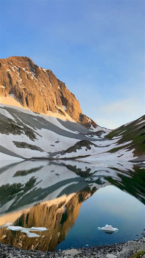 Download Wallpaper 938x1668 Mountains Snow Lake Reflection